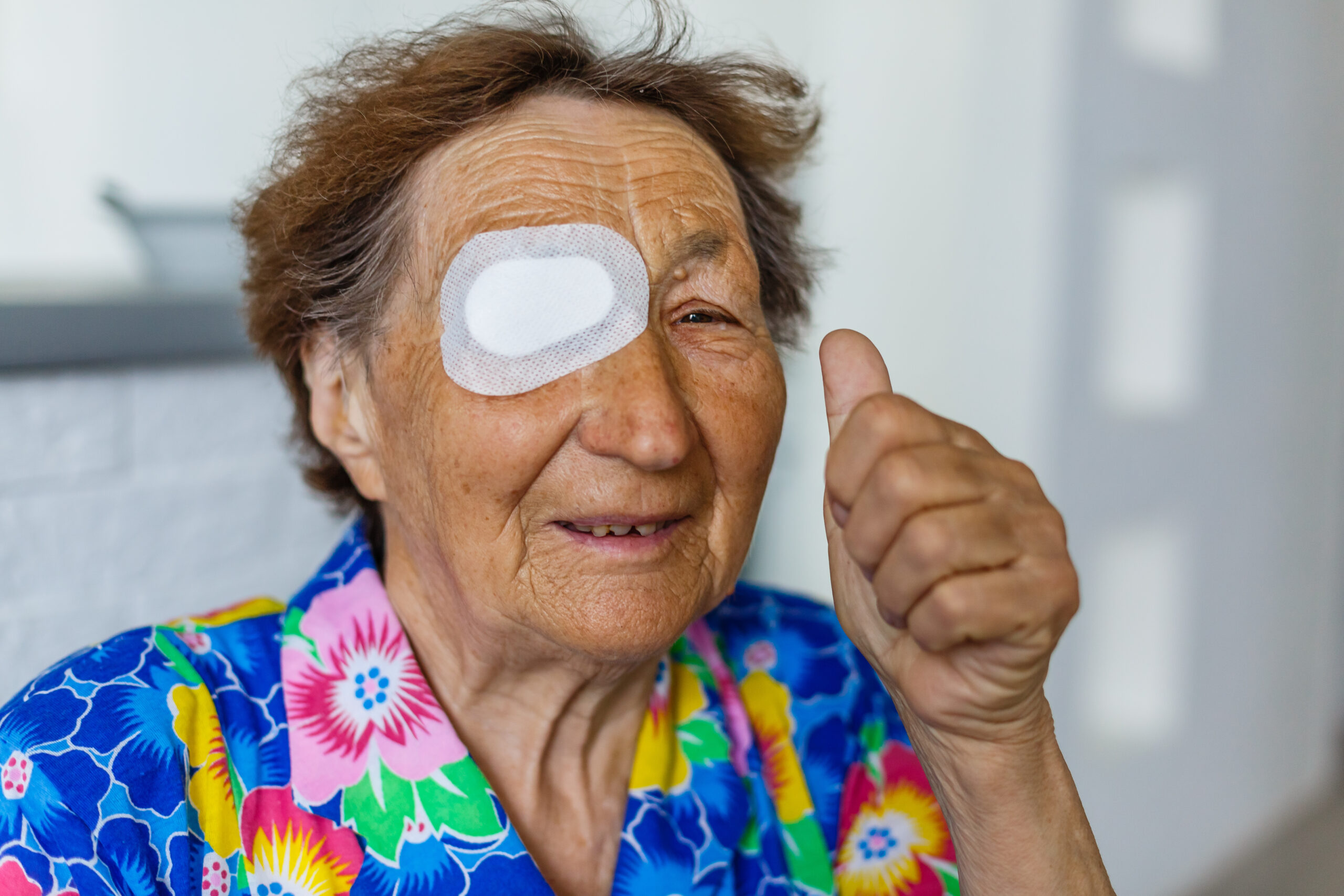 bandage on eye of a senior person